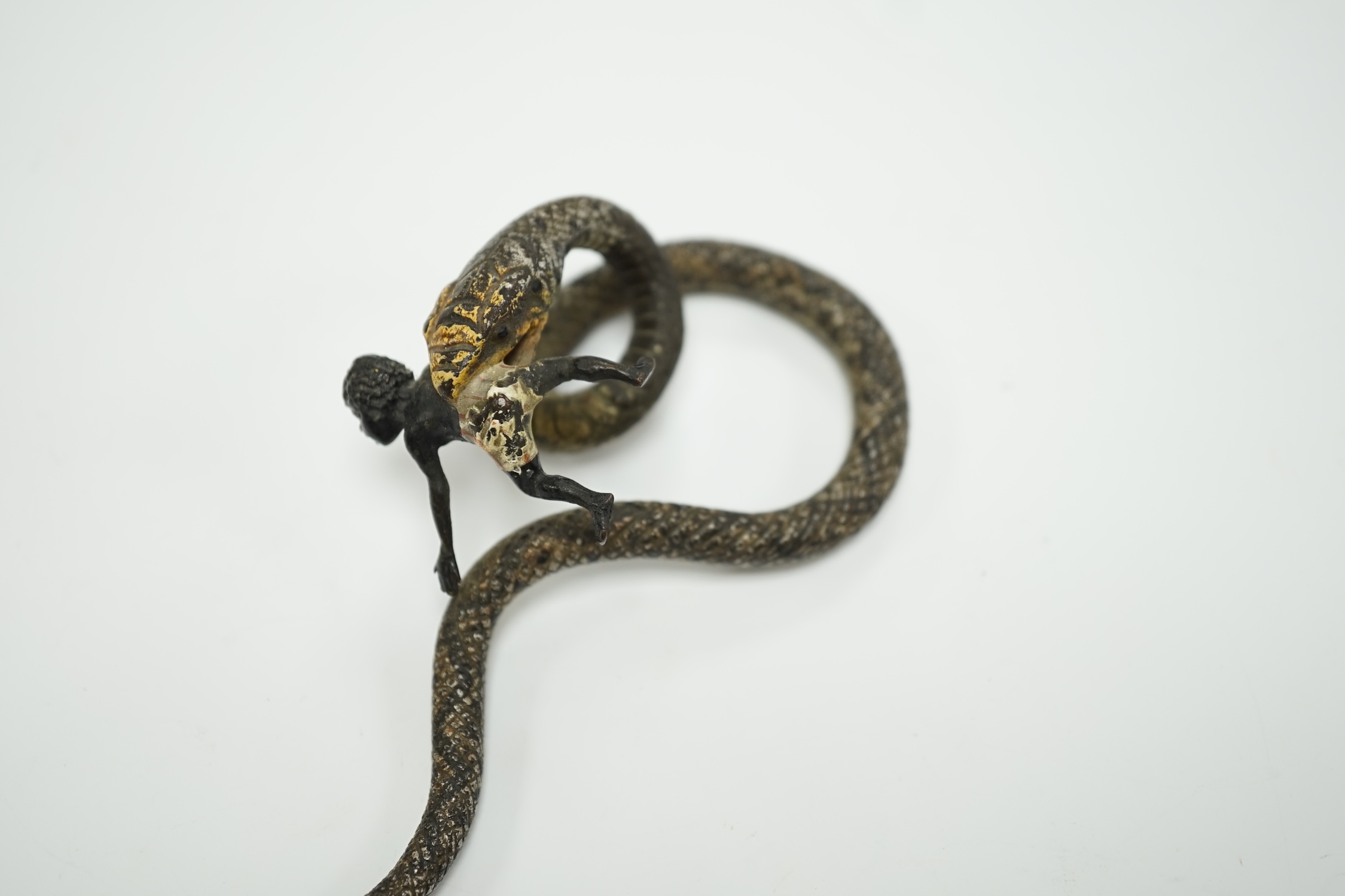 A Viennese cold painted bronze snake devouring a man, 14cm long
